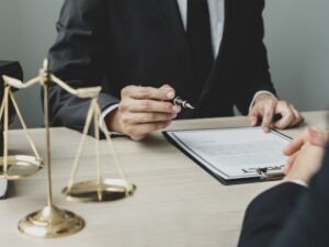 A man lawyer or a judge counseling clients about judicial justice and prosecution with scales, judge