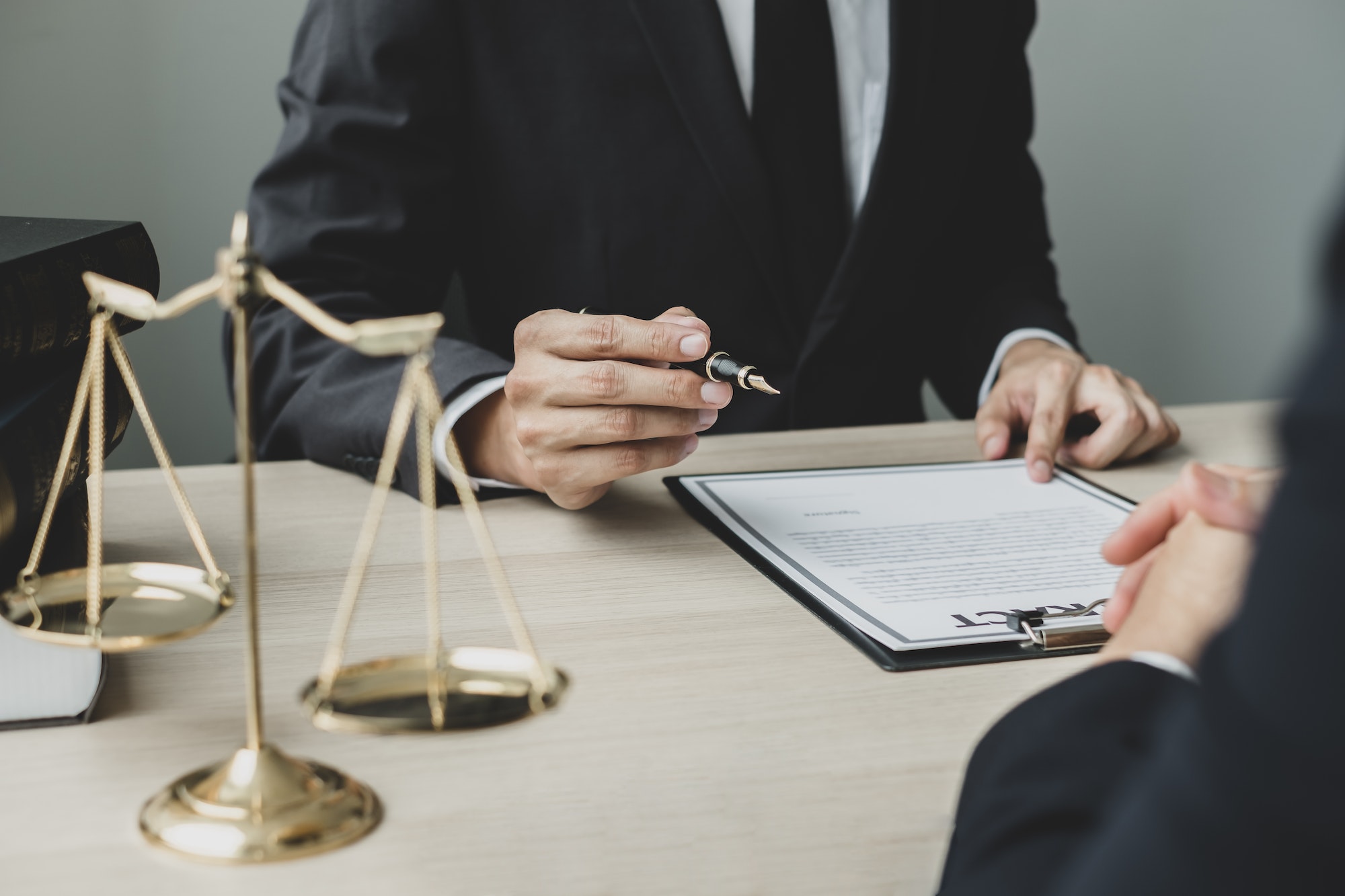 A man lawyer or a judge counseling clients about judicial justice and prosecution with scales, judge